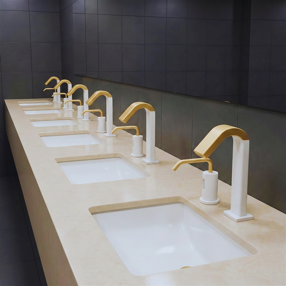 Commercial touchless faucets installed in a stadium restroom designed for heavy traffic use